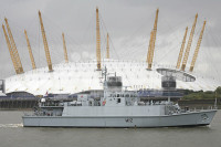 HMS Shoreham  passes the O2 Greenwich
