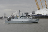 HMS Shoreham  passes the O2 Greenwich
