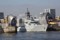 HMS Tyne passes theough the Thames Barrier London